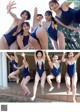 A group of young women in blue swimsuits posing for a picture.